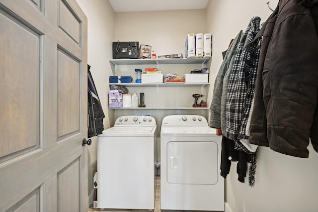 laundry area with independent washer and dryer