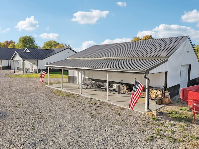 back of property with an outbuilding