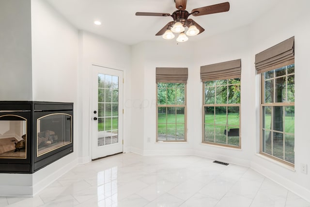 interior space featuring ceiling fan