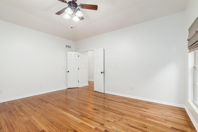 spare room featuring light hardwood / wood-style floors and ceiling fan