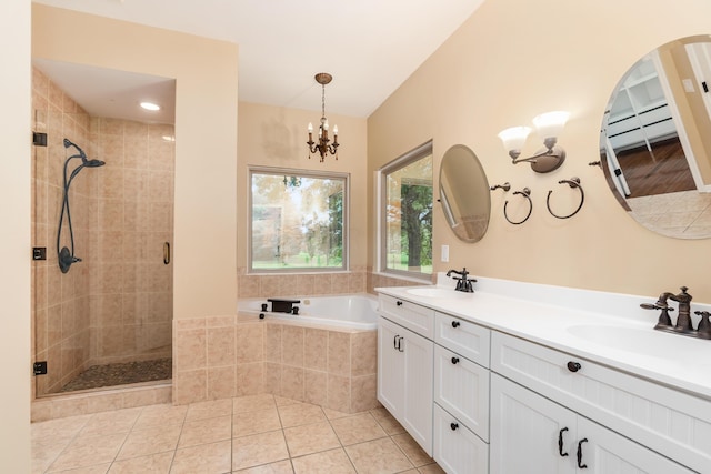 bathroom featuring tile patterned floors, vanity, plus walk in shower, and a chandelier