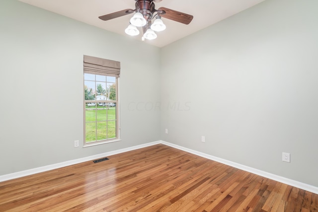 empty room featuring ceiling fan and light hardwood / wood-style floors