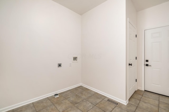 laundry area featuring hookup for an electric dryer, washer hookup, and light tile patterned floors