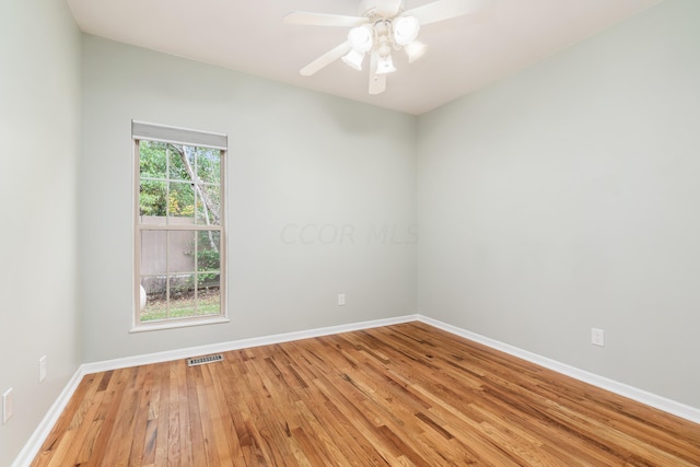 unfurnished room with ceiling fan, a healthy amount of sunlight, and light hardwood / wood-style floors