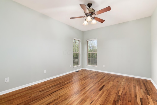 unfurnished room featuring ceiling fan and hardwood / wood-style flooring