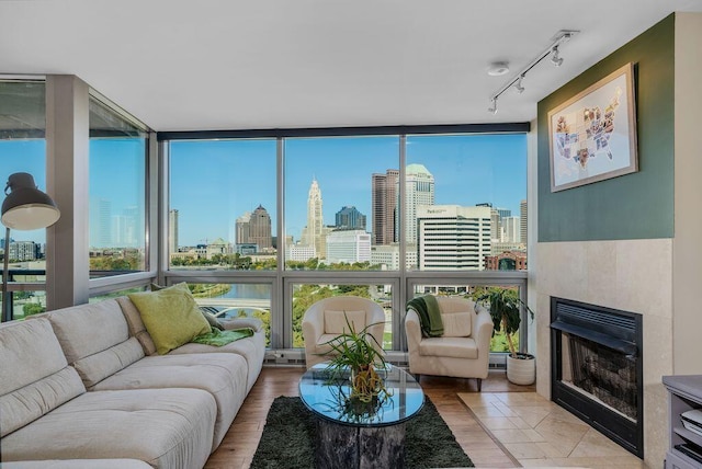 interior space featuring expansive windows and a fireplace