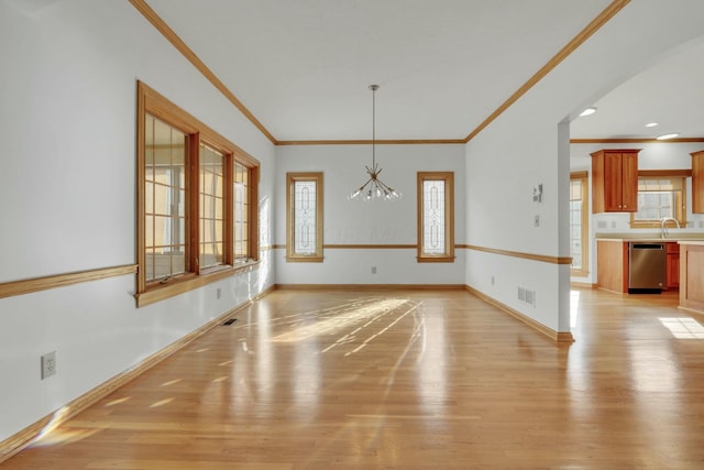 unfurnished dining area with light wood-style floors and a healthy amount of sunlight