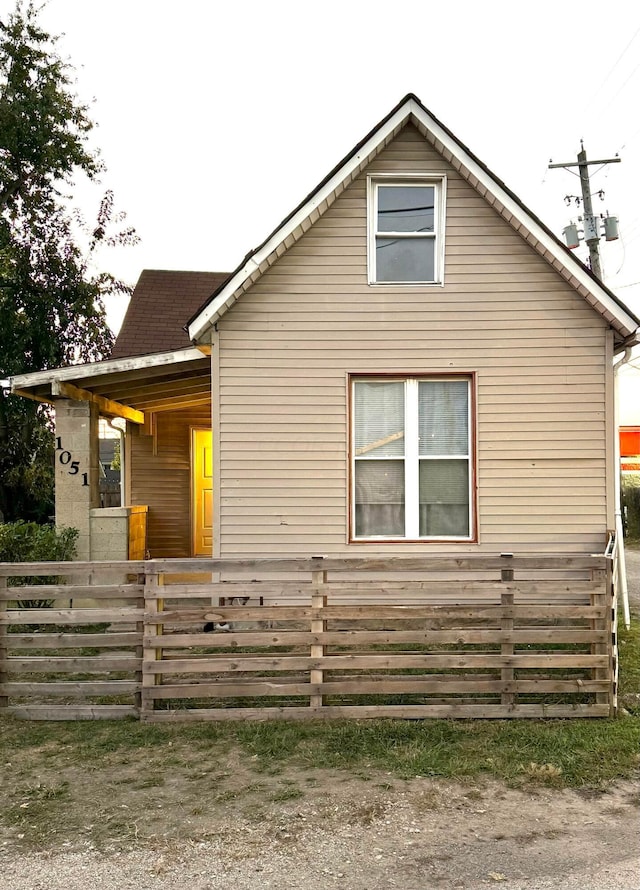 view of side of property with a porch