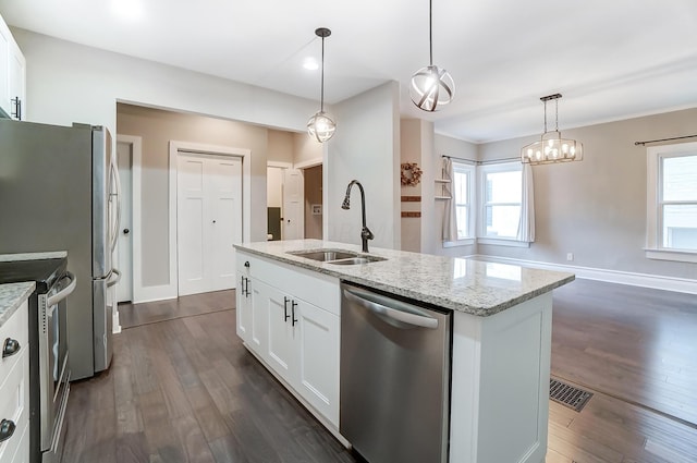 kitchen featuring sink, white cabinets, stainless steel appliances, and plenty of natural light