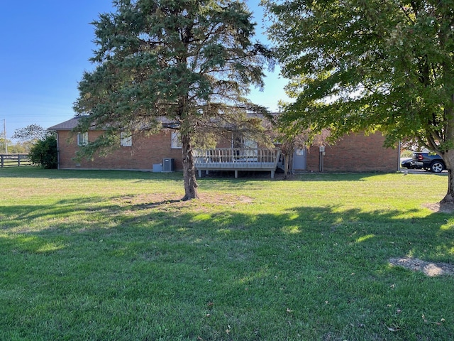 view of yard with a wooden deck