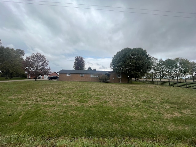 view of yard with a rural view