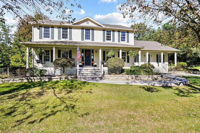 colonial-style house with a front lawn and covered porch