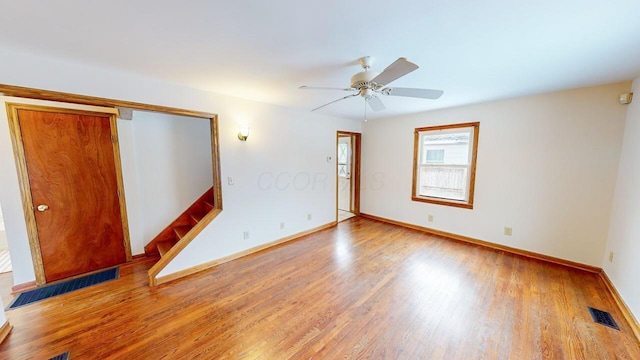 unfurnished room featuring hardwood / wood-style flooring and ceiling fan