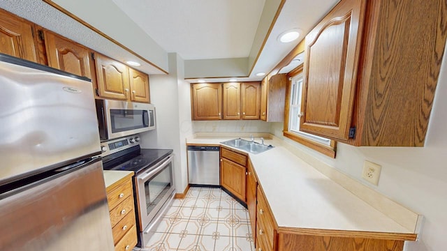 kitchen with appliances with stainless steel finishes and sink