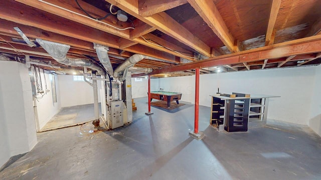 basement featuring billiards and heating unit