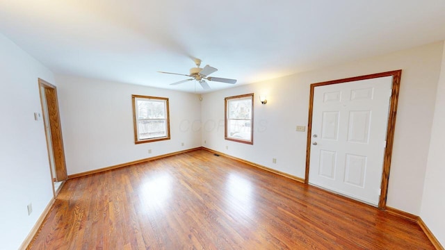 unfurnished room featuring wood-type flooring and ceiling fan