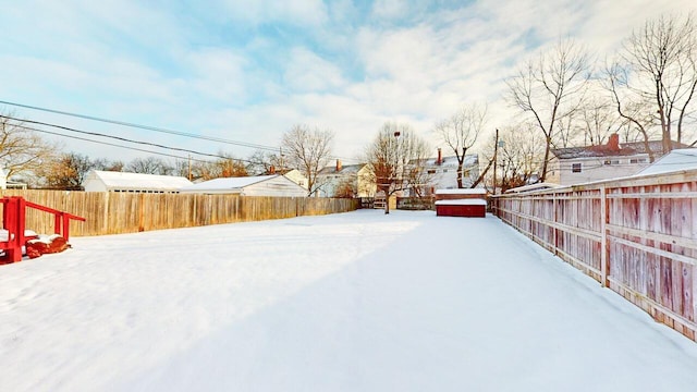 view of yard covered in snow