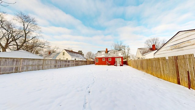 snowy yard with an outdoor structure