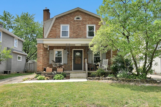 view of front of house with a front lawn and a porch