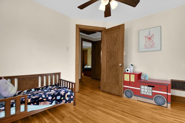 bedroom featuring ceiling fan and light hardwood / wood-style floors