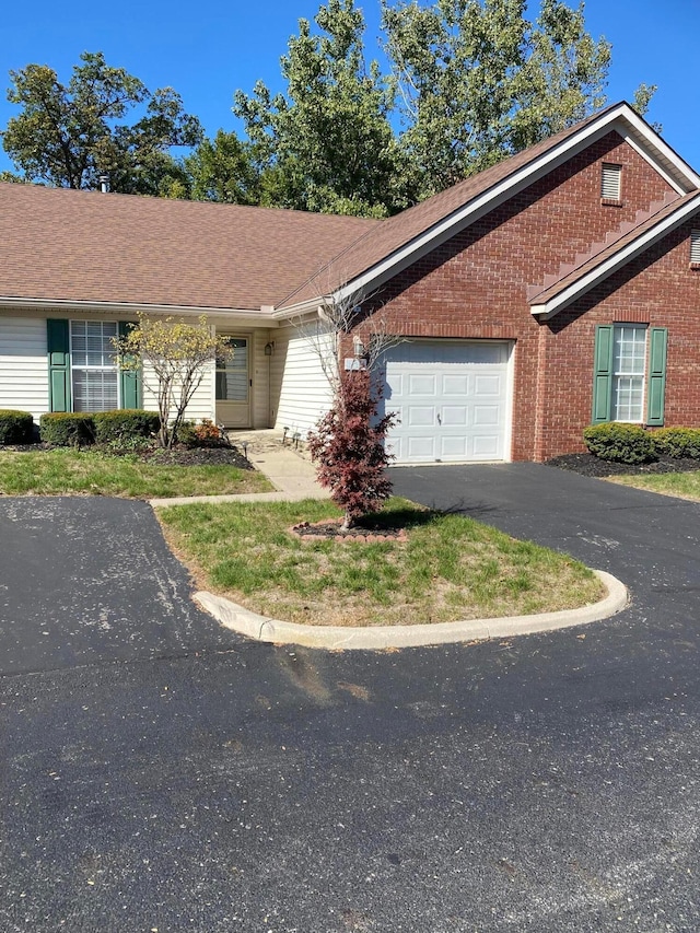 single story home featuring a garage