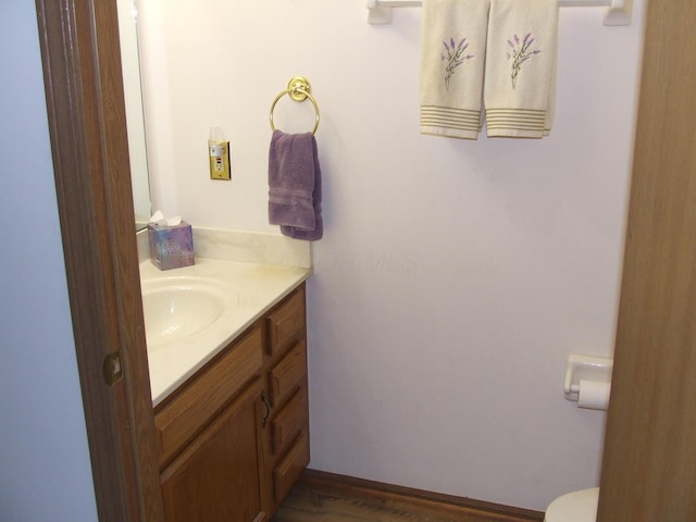 bathroom featuring vanity and hardwood / wood-style flooring