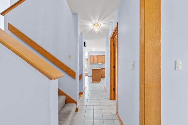 hall featuring light tile patterned floors