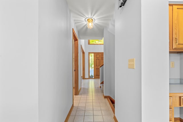 hallway featuring light tile patterned floors