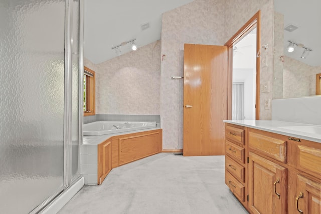 bathroom with vanity, lofted ceiling, plus walk in shower, and track lighting