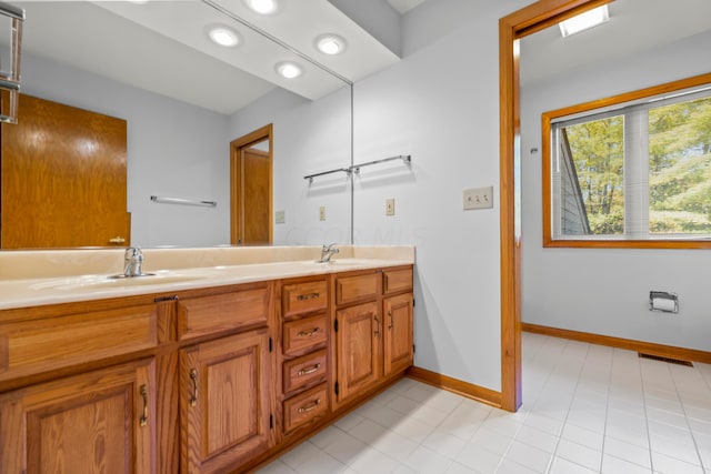 bathroom with vanity and tile patterned floors