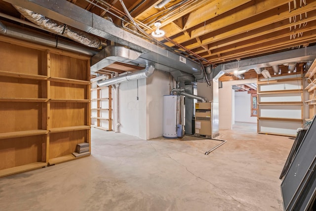 basement featuring gas water heater and heating unit