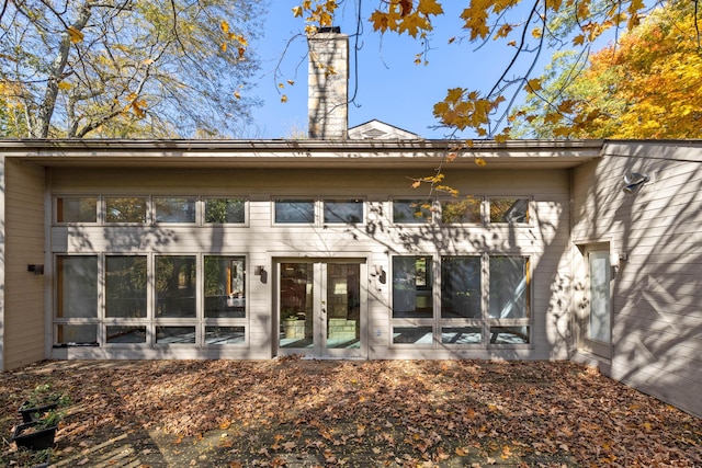 rear view of house featuring french doors