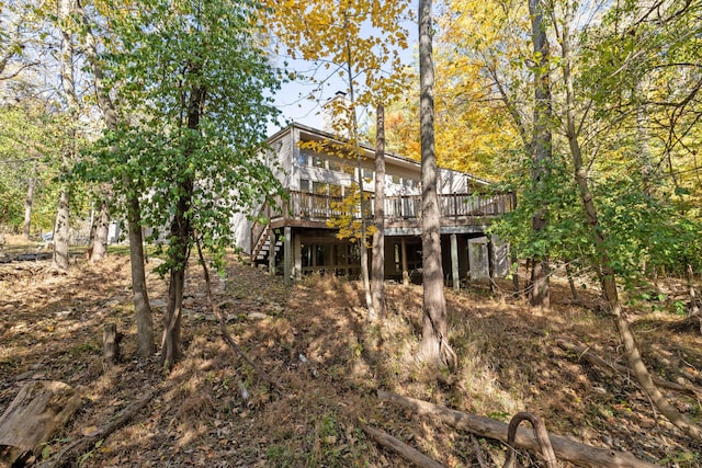 back of house with a wooden deck