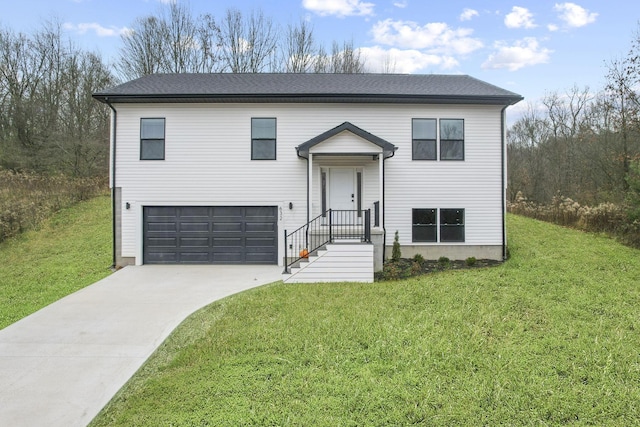 bi-level home with a garage and a front yard