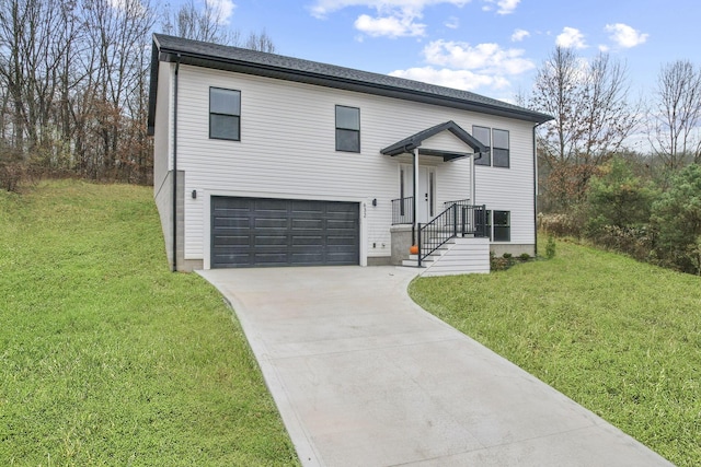 bi-level home featuring a front yard and a garage