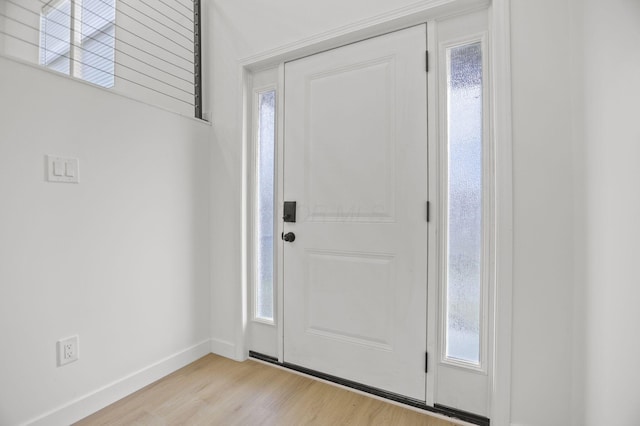 foyer with light wood-type flooring