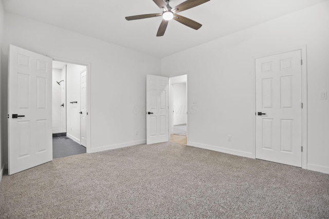 unfurnished bedroom featuring ceiling fan and dark colored carpet