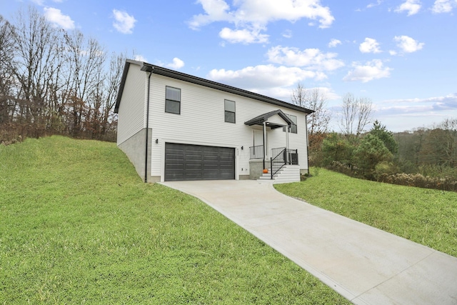 view of front of property with a front lawn and a garage