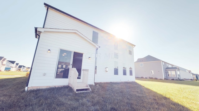 rear view of house with a lawn