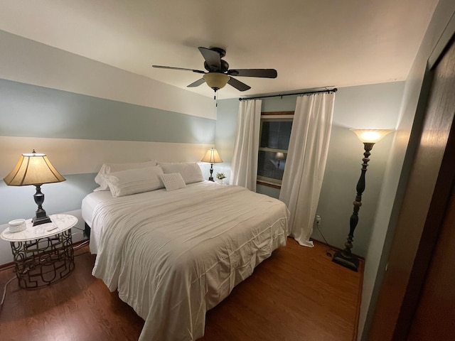 bedroom featuring dark hardwood / wood-style floors and ceiling fan