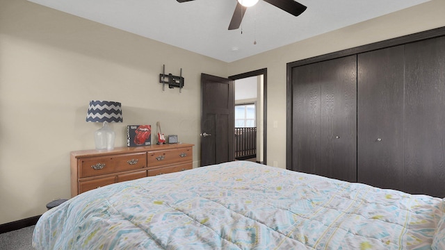 carpeted bedroom with ceiling fan and a closet