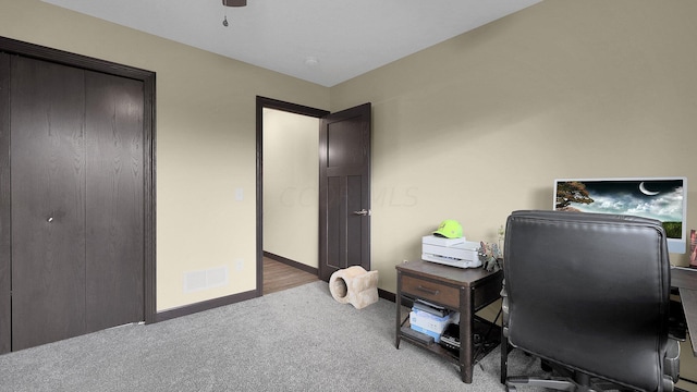 office space with carpet flooring and ceiling fan