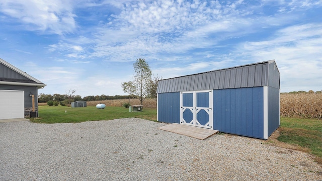 view of outdoor structure featuring a yard