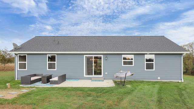 back of property featuring a yard, an outdoor hangout area, and a patio area