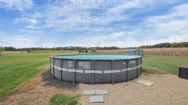 view of pool featuring a yard