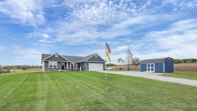 view of front of home with an outbuilding and a front lawn