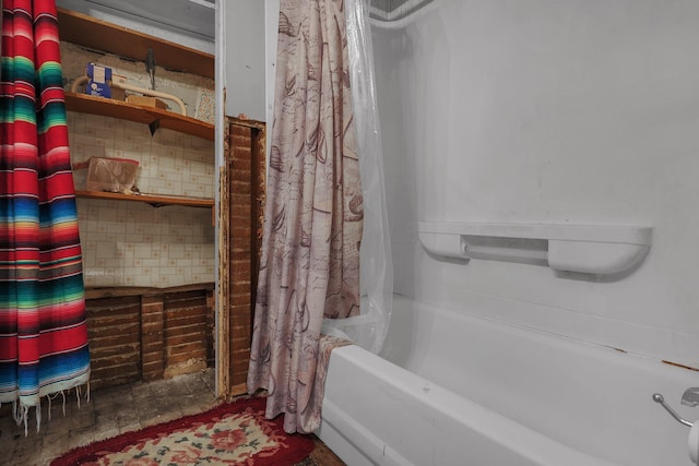 bathroom featuring tasteful backsplash and shower / tub combo with curtain