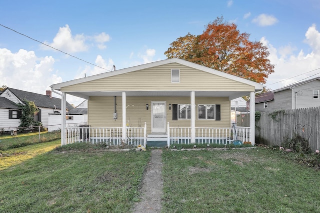 bungalow-style house with a porch and a front yard