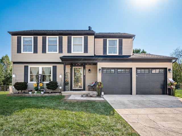 view of front of property with a garage and a front lawn