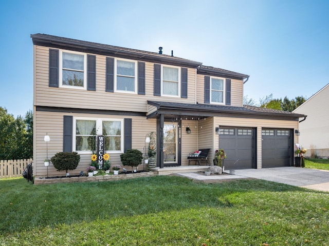 view of front of house with a front yard and a garage